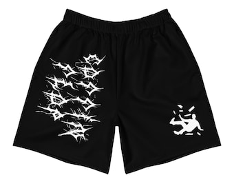 May include: Black athletic shorts with a white graphic print of a person falling and a repeating pattern of jagged lines on the left leg.