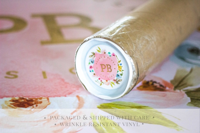 May include: Close-up of a rolled-up print with a floral design and the initials "PB" in a circle. The print is packaged in a brown tube with a white end cap.