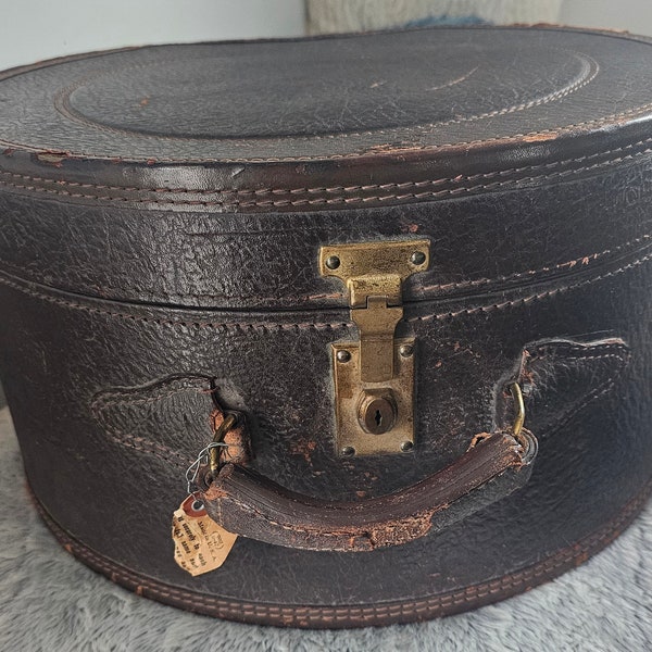 vinatge leather suitcase - round hat box.  Antique