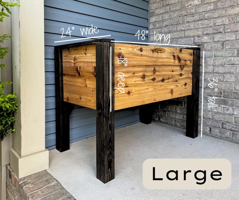 May include: Large wooden planter box, 24 inches wide, 48 inches long, 18 inches deep, and 36 inches tall. The planter has a natural wood finish with black legs and trim. The word "Large" is displayed at the bottom.