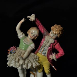 Dresden Volkstedt porcelain girl & boy dancing figurine.
