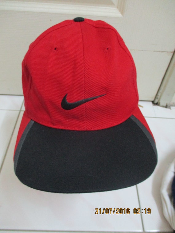 red and black nike hat
