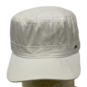 May include: A white cotton military style cap with a small logo on the side.
