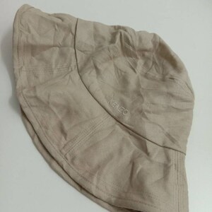 May include: A beige bucket hat with the word "KENZO" embroidered on the front.