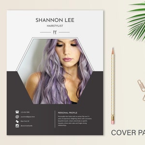May include: A black and white business card with a hexagonal frame featuring a woman with long, purple hair. The text "SHANNON LEE" and "HAIRSTYLIST" is printed in black at the top of the card. Contact information is listed below the image.