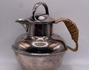 Small Silver plated pitcher with a wicker wrapped handle