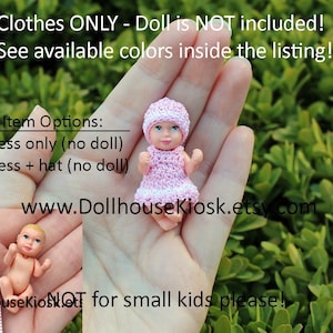 May include: A pink crocheted dress and hat for a doll. The doll is not included. The text "Clothes ONLY - Doll is NOT included! See available colors inside the listing!" is at the top of the image. The text "Item Options: -dress only (no doll) -dress + hat (no doll)" is in the middle of the image. The text "www.DollhouseKiosk.etsy.com" is at the bottom of the image. The text "DollhouseKiosk NOT for small kids please!" is at the bottom of the image.