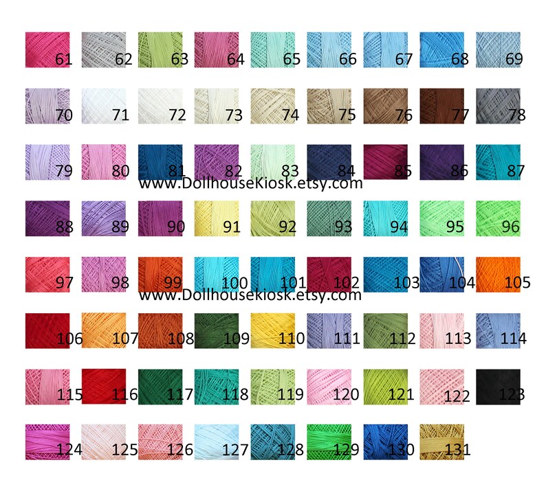 May include: A color chart of 131 different shades of embroidery floss. The floss is wound on small spools and arranged in rows. The colors range from bright to muted and include shades of red, orange, yellow, green, blue, purple, pink, brown, and gray.