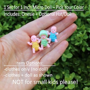 May include: Three miniature baby dolls, each wearing a different colored crocheted outfit: yellow, green, and blue. The dolls are approximately 1 inch in size. The image includes text that reads "1 Set for 1 Inch Micro Doll - Pick Your Color".