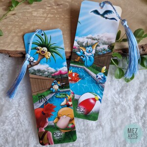 May include: Two colourful bookmarks featuring a pool scene with various Pokemon characters. The bookmarks are rectangular and have a blue tassel. The text "MEZ Arts" is visible on both bookmarks.