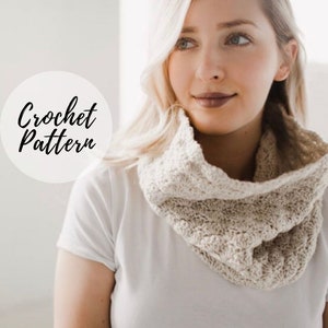 May include: A close-up of a woman wearing a beige crochet cowl neck scarf. The text "Crochet Pattern" is written in black on a white circle.