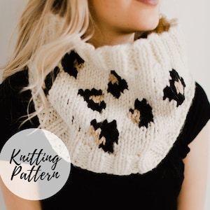 May include: Knitting pattern for a white cowl with black and tan leopard print design. The cowl is shown being worn by a person.