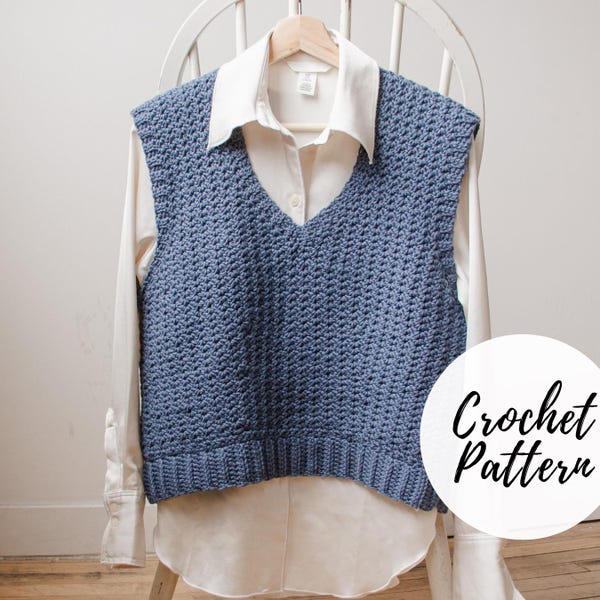 May include: A blue crocheted vest with a V-neckline. The vest is displayed on a white shirt and a white chair. The text "Crochet Pattern" is visible in the lower right corner of the image.