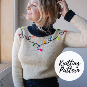 May include: A white knitted sweater with a black mock neck and a colorful string of lights design on the front. The text "Knitting Pattern" is on a white circle in the lower right corner of the image.