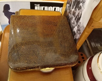 Cigarette case, leather bound in fine condition.