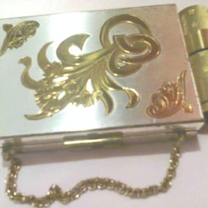 Vintage powder compact.  Zell carry all cigarette case and lipstick holder all in one, plus lipstick in gold tone case.