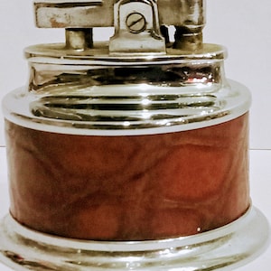 Vintage table lighter.  Rolstar lighter with brown pressed leather boarder.