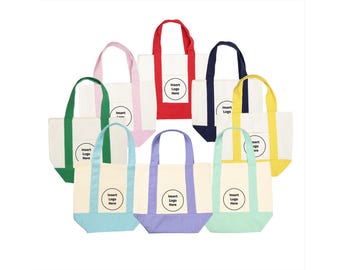 May include: A collection of eight canvas tote bags in various colors including red, pink, green, navy blue, yellow, light blue, purple, and mint green. Each bag features a white center panel with a circular graphic containing the text Insert Logo Here.