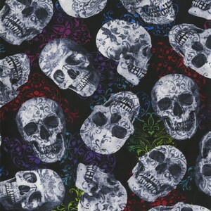 May include: A repeating pattern of gray skulls with ornate floral designs on a black background. The skulls are interspersed with colorful, swirling floral accents in red, purple, blue, and green.