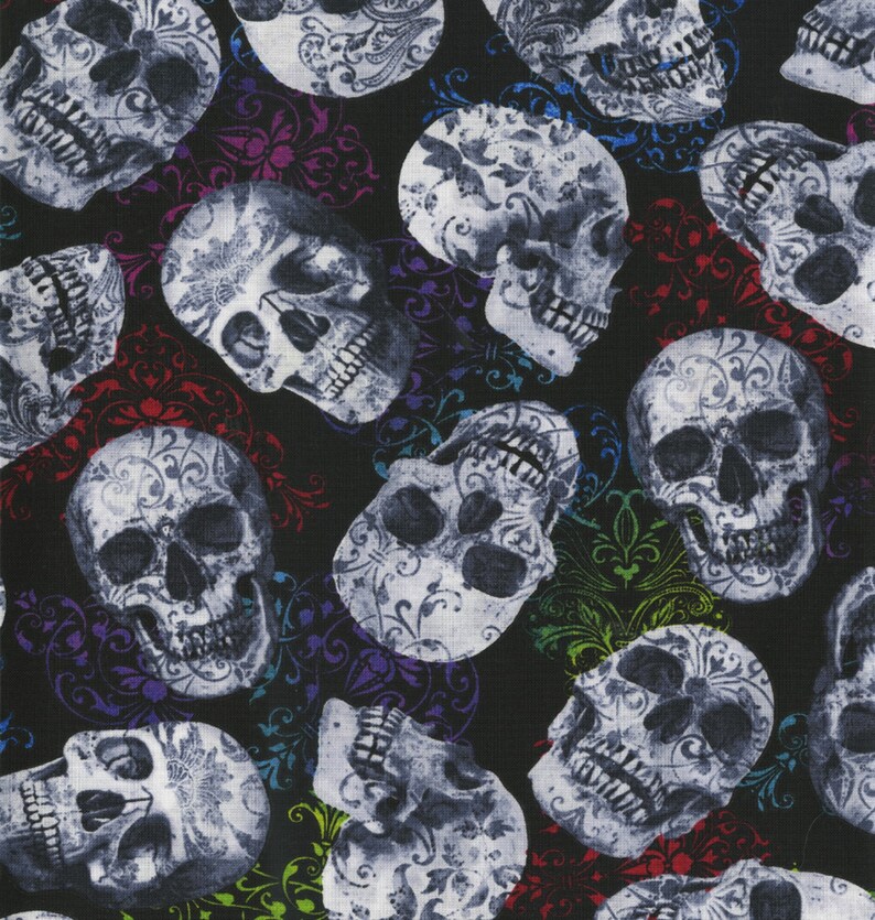 May include: A repeating pattern of gray skulls with ornate floral designs on a black background. The skulls are interspersed with colorful, swirling floral accents in red, purple, blue, and green.