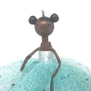 Ballerina in a Teal and White Sparkly Dress