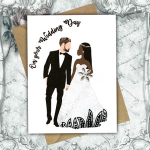 An interracial wedding card with a white groom and a black bride. The groom is wearing a black tuxedo and the bride is wearing a white a-line dress. The text on the card reads 'On your Wedding Day'.