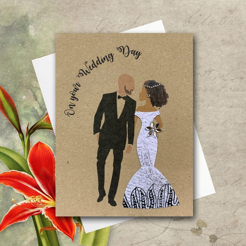 Wedding card showing bald white man with a brown beard and black woman with light brown skin and curly brown hair. Fabric dress is hourglass shape. Card colour is brown