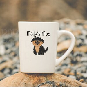 May include: White ceramic mug with a black and brown Yorkshire Terrier illustration and the text "Molly's Mug" printed on the front.