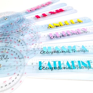 May include: A set of clear plastic goniometers with a black and red scale. The goniometers are labeled with names, including "Jessica Occupational Therapy" and "Katharine Occupational Therapy".