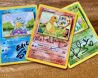 Autographed Pokemon Cards! Get all 3 Starters signed by the original actors who voiced them, Bulbasaur, Squirtle, Charmander, Eric Stuart