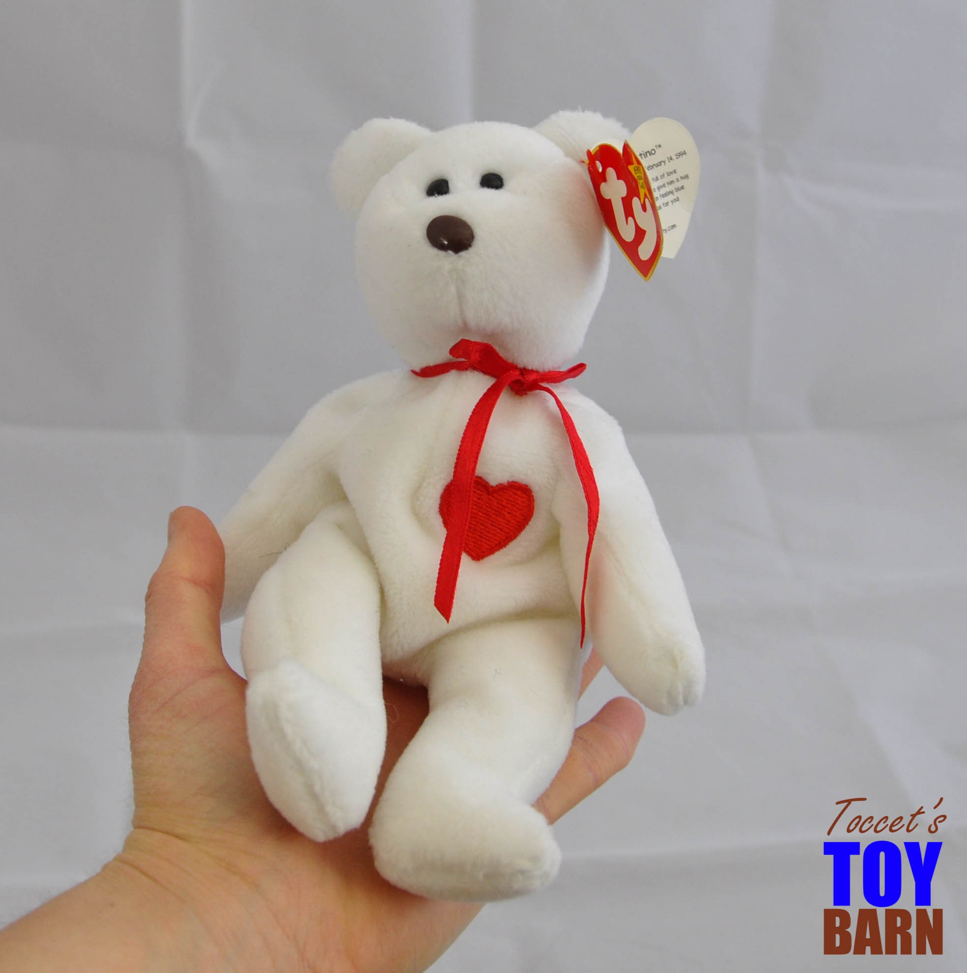white beanie baby with red heart
