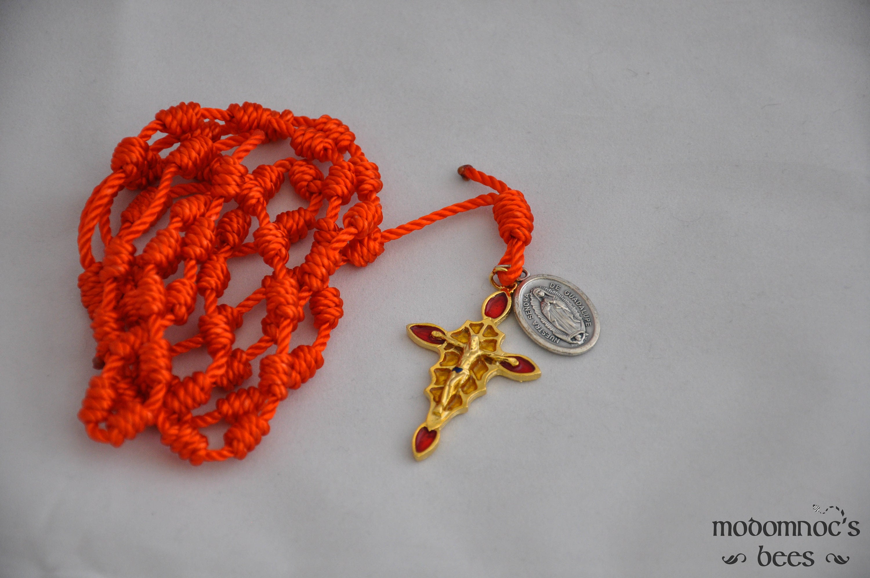 Orange Knotted Twine Spanish Rosary Featuring a Stained Glass Style