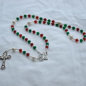 Christmas Rosary With Red and Green Beads, Silver Ornament Beads, and Holy Family Nativity Centerpiece