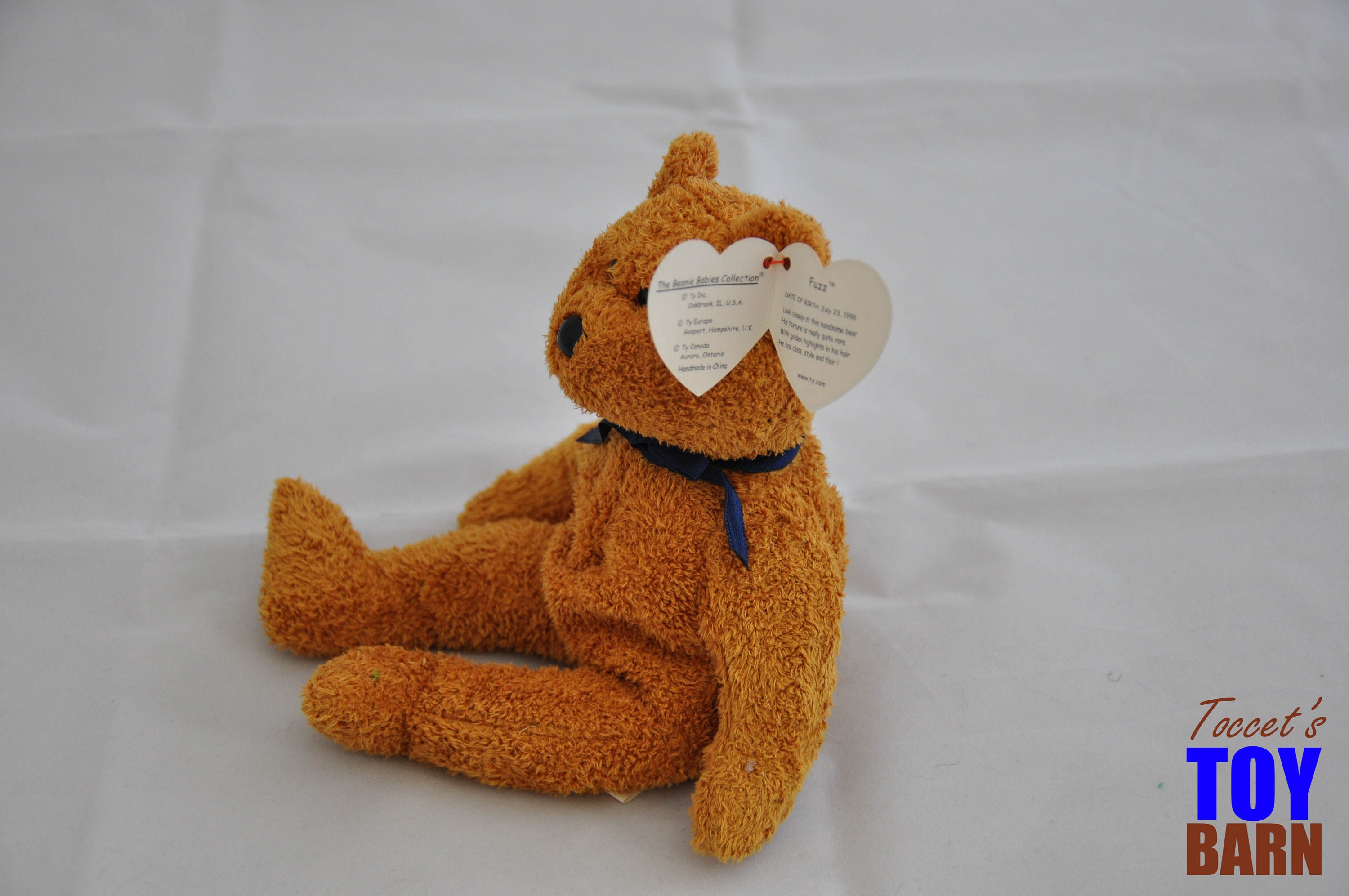Vintage 1998 Ty Beanie Baby Fuzz the Bear with a Navy Blue Ribbon