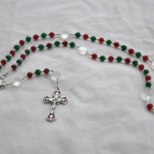 Christmas Rosary With Red and Green Beads, Snowflake Beads, and Holy Family Nativity Centerpiece