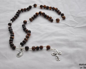 Acai Nut Wood Bead and White Twine Rosary with a Lattice Crucifix and a St. Damien of Molokai Patron Saint Medal