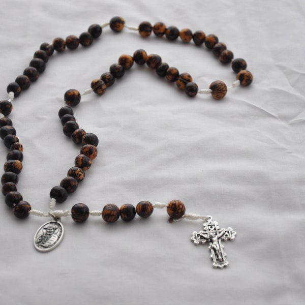 Acai Nut Wood Bead and White Twine Rosary with a Lattice Crucifix and a St. Damien of Molokai Patron Saint Medal