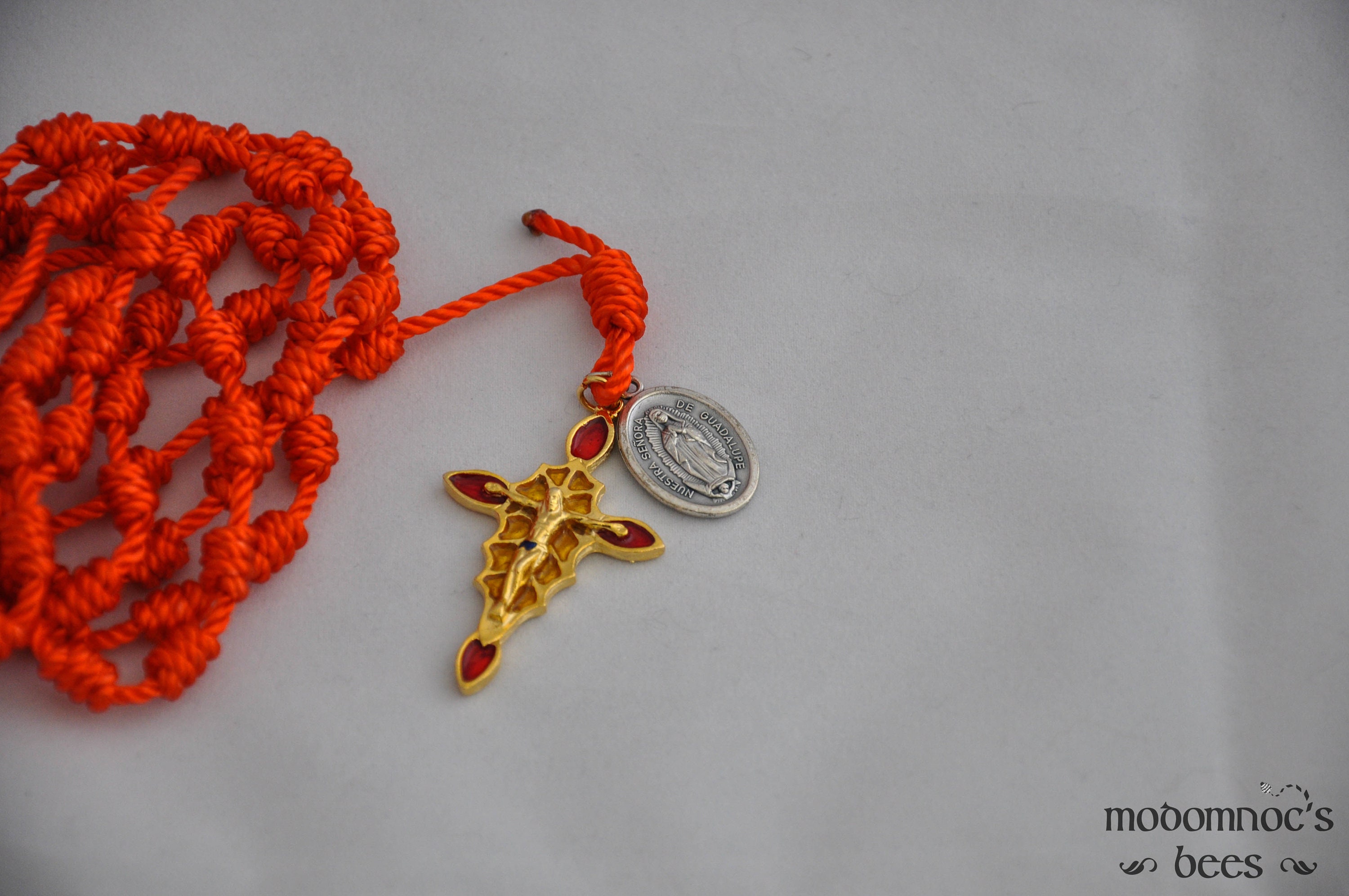 Orange Knotted Twine Spanish Rosary Featuring a Stained Glass Style