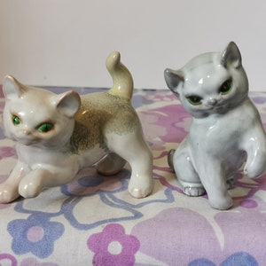 Vintage Chinese ceramic cat pair of ornaments. Set of 2 cute china kitty cat figures, green eyes. Small shelf home decor gift. Midcentury.