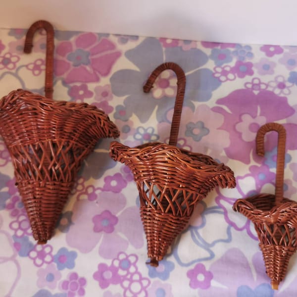 Vintage wicker umbrella wall pockets. Set of 3 rattan basket parasol wall hanging decor. Cute trio of wall decor woven wicker natural rustic