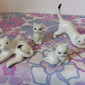 Vintage miniature ceramic cat family. Set of 4 small white kitty cat ornaments. Cute cat lover home decor gift. China cat set, mini cats.