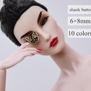 May include: Gold butterfly shank button with black detailing. The button is 6x8mm and comes in 10 colours. shank button 6x8mm 10 colours