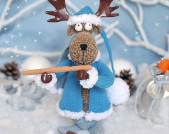 Christmas elk a deer Santa Claus's assistant in a cap, a jacket toy amigurumi crochet