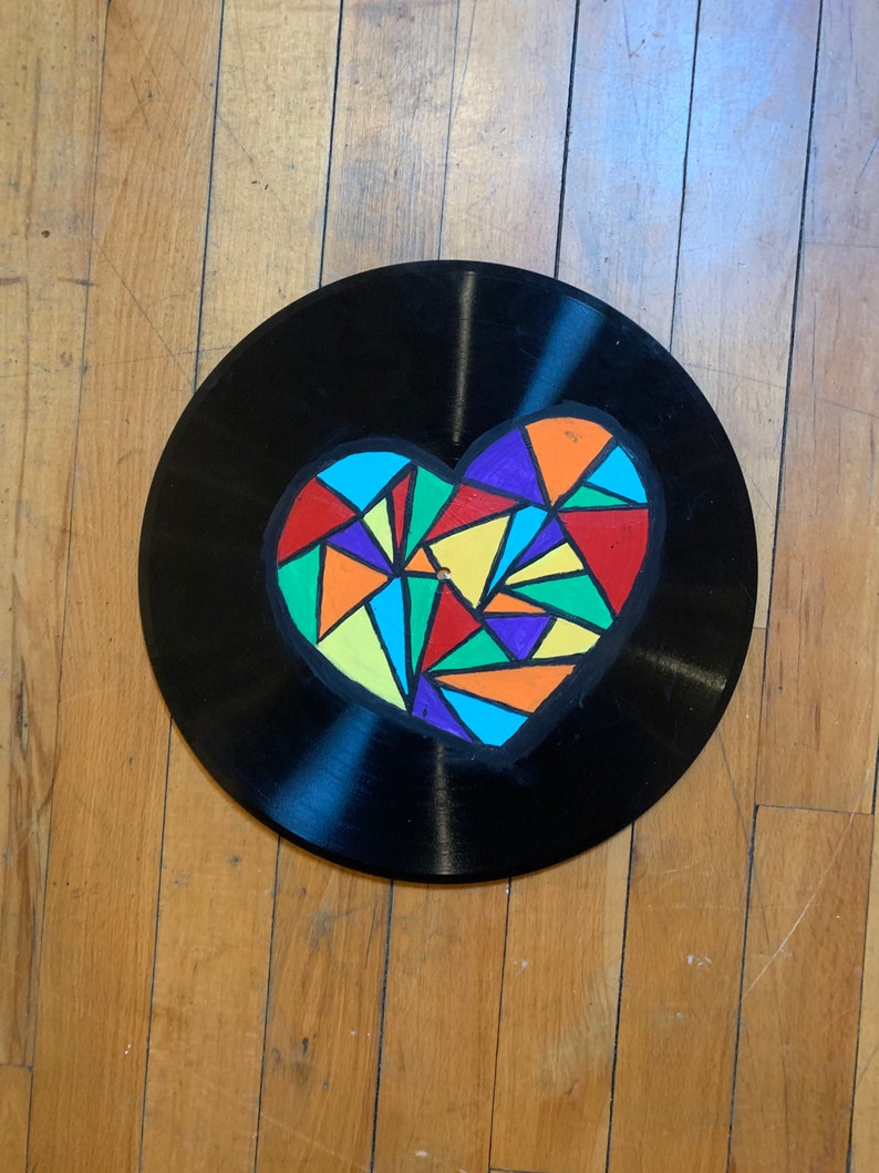 Geometric heart painting on record