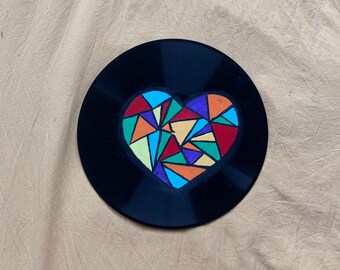Geometric heart painting on record