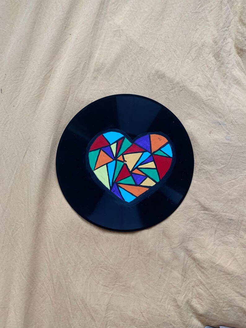 Geometric heart painting on record