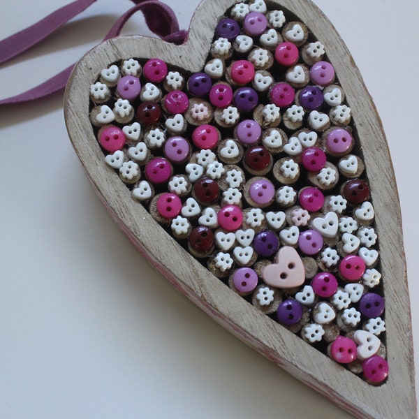 Pretty wood heart decorated in tiny buttons