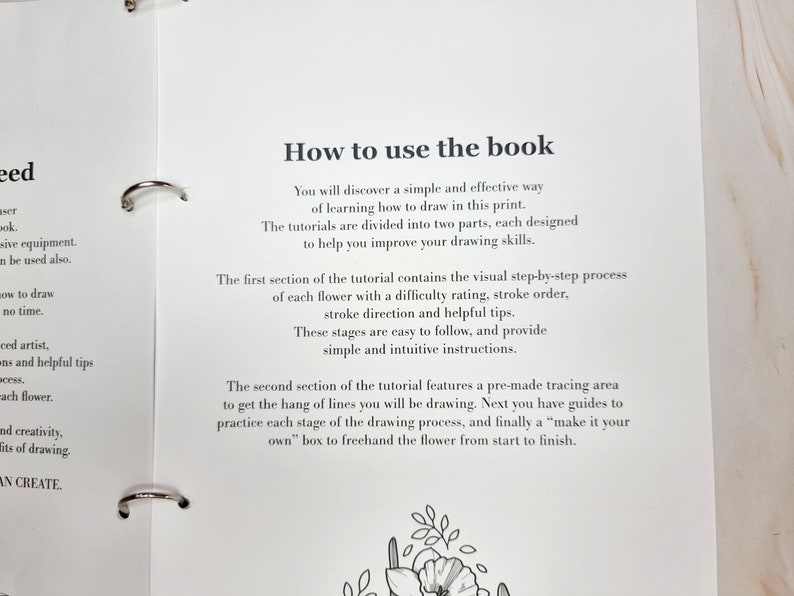 May include: A book titled "How to use the book" with instructions on how to draw flowers. The book features a step-by-step process with difficulty ratings, stroke order, and helpful tips. It also includes a pre-made tracing area to practice drawing.