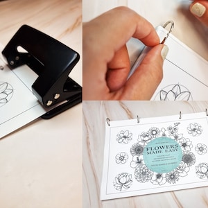 Op de afbeelding: Een zwarte perforator wordt gebruikt om gaten te maken in een wit vel papier met een tekening van een bloem. Het papier wordt vervolgens in een map met zilveren ringen geplaatst. De map heeft een omslag met de tekst "Botanicals Vol. 1 Flowers Made Easy Step by Step Beginner Friendly Flower Drawing Guides with Simple Guides".
