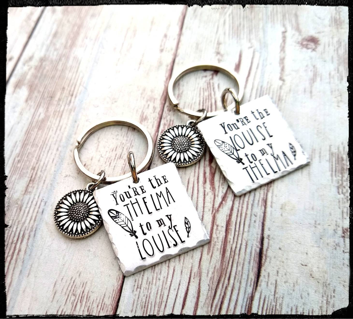 BlueReefBoutique Thelma & Louise * Matching Keychain Set | Hand Stamped Aluminum | Sunflower Charm / Feather | Friend Keychain Set | Gift Set